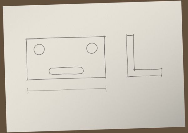 A photo of a pencil sketch of a plate and an L profile, on paper on a desk